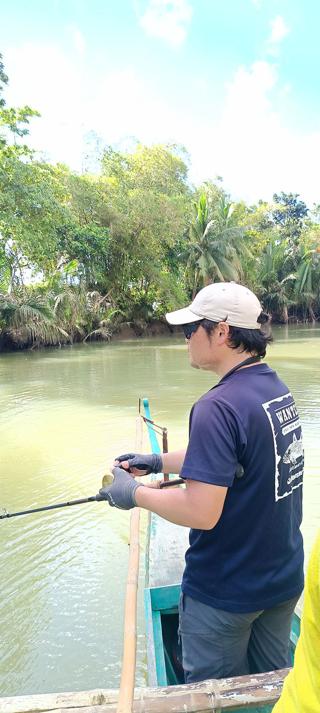 Angler fishing from a boat on the river