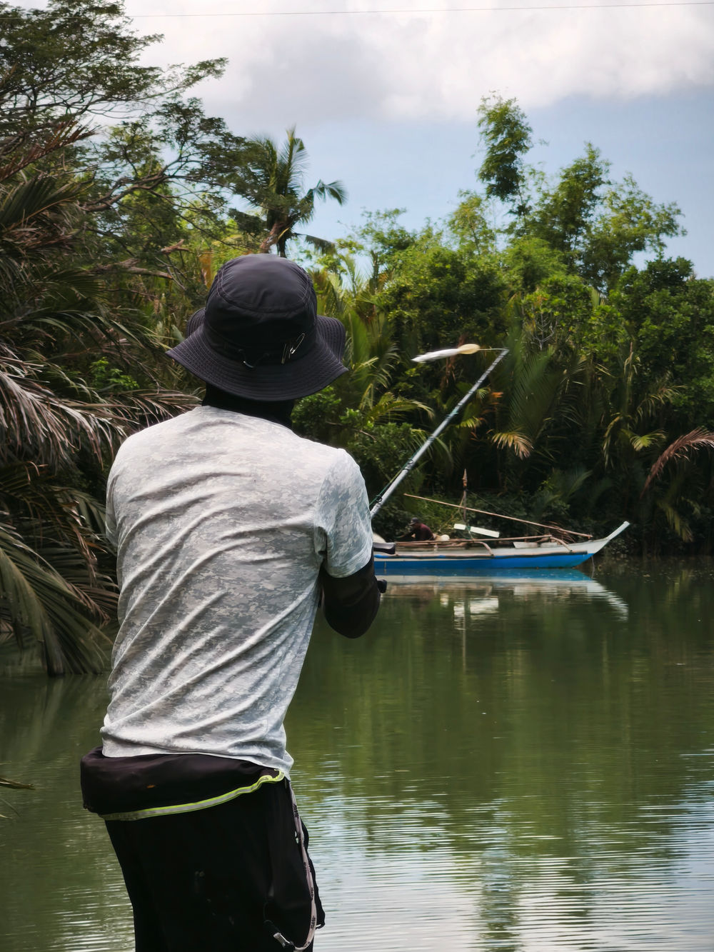 Casting into the mangrove edge from a boat